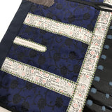 [O-063] Black-lacquered Thigh armor